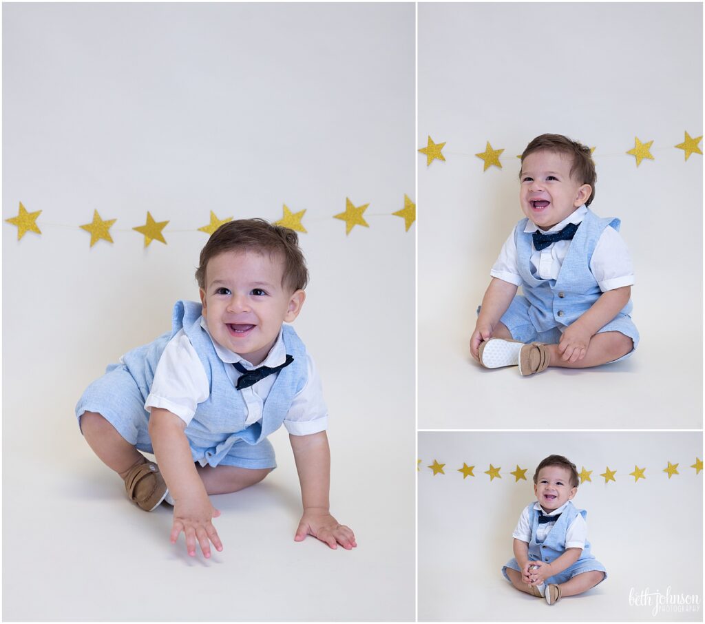 one year old boy in suit with star background