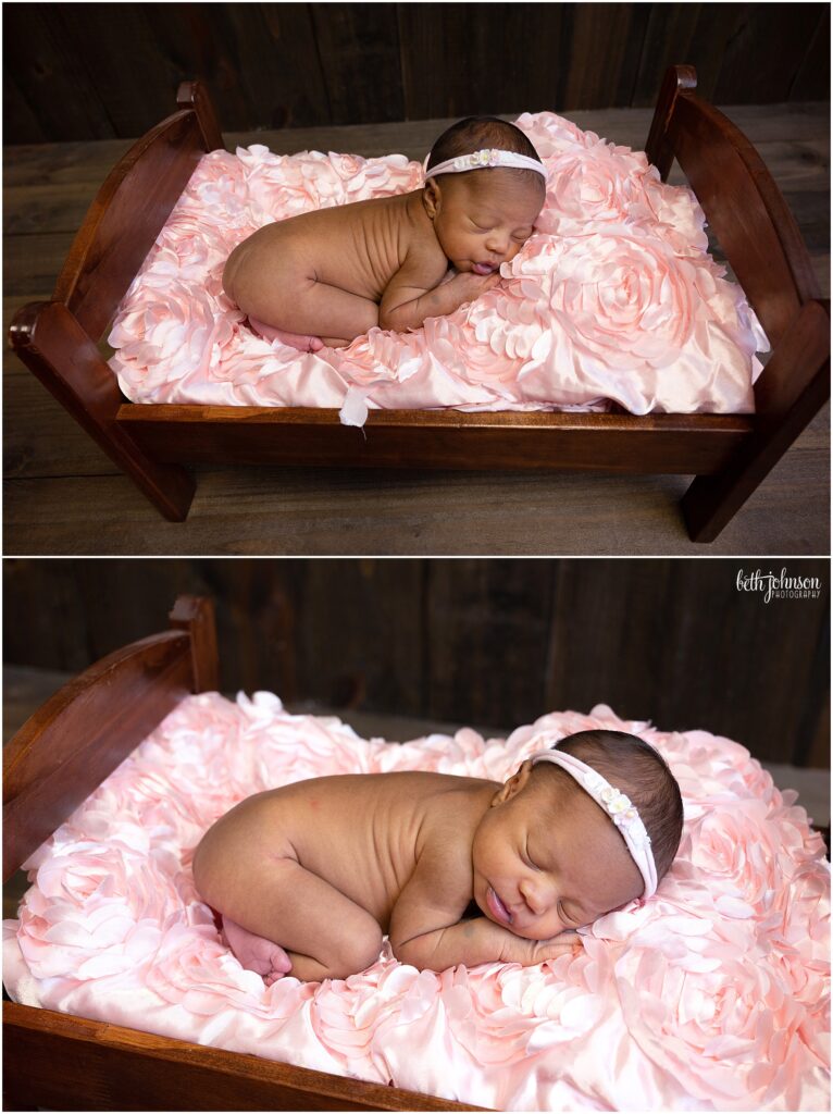 baby girl in wooden newborn bed