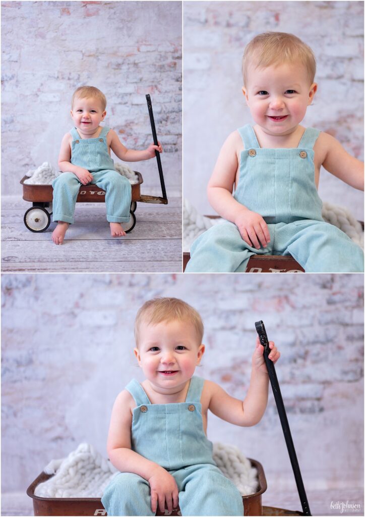 baby in knit overalls sitting In vintage wagon