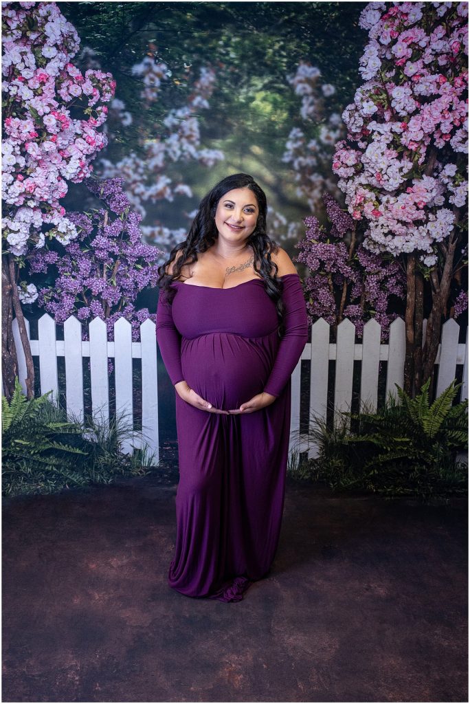 sew trendy purple gown on floral backdrop