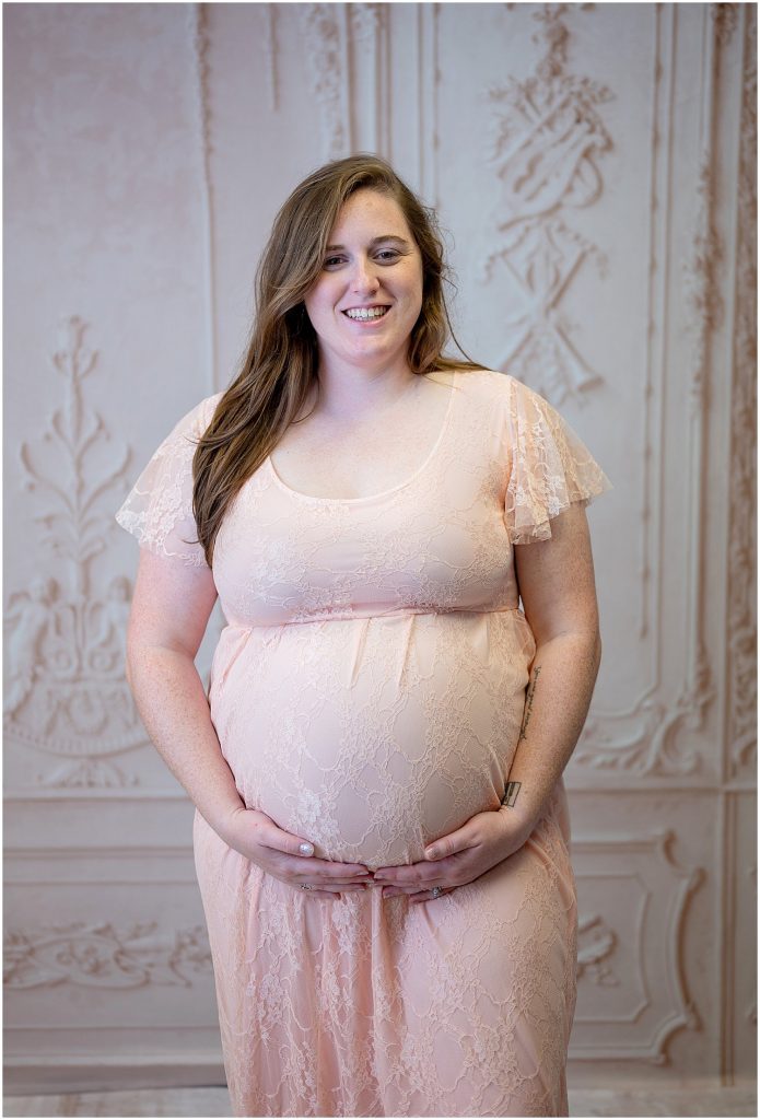 mom in light pink lace maternity gown