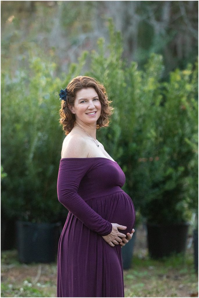 backlit maternity portrait outdoors