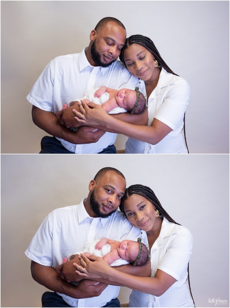 mom and dad holding newborn daughter