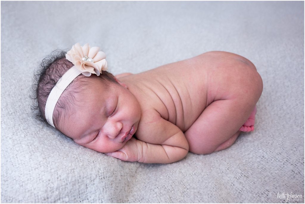 newborn baby girl with gold headband
