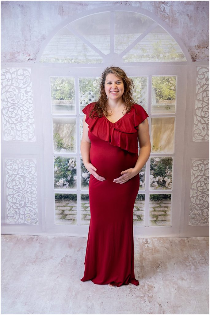 studio maternity photography red gown