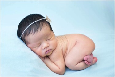 baby girl on blue blanket