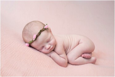 newborn girl bum up pose on pink