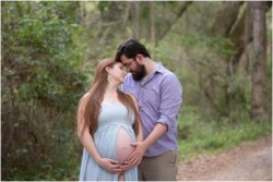 maternity photo dads hand on moms belly