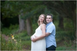 maternity photo outdoors mom and dad