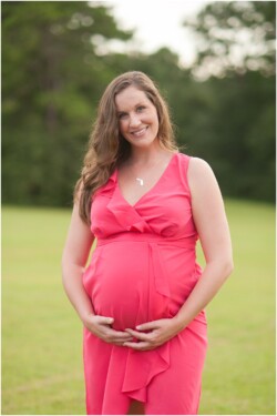 backlit pregnancy photo outdoors coral dress