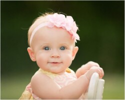 baby girl sitting backwards in chair