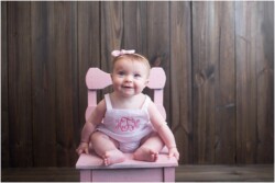 pink seersucker monogramed romper portrait