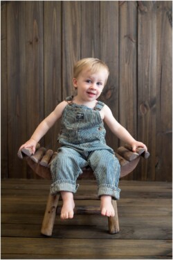 toddler in vintage oshkosh overalls