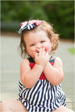 toddler girl blowing kisses patriotic romper