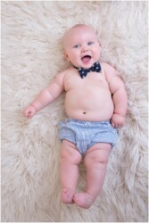 cute chubby baby on white rug