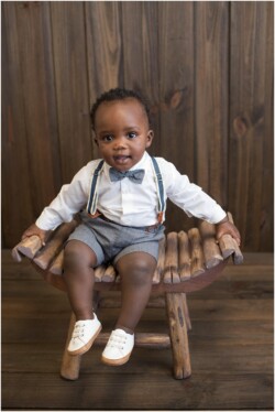 dapper dressed baby in phtoography studio