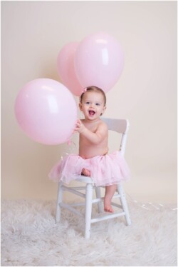 birthday girl holding balloons pink tutu