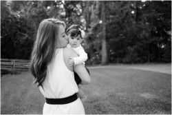 black and white mom kissing baby
