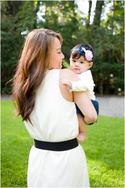 mother looking at baby over shoulder