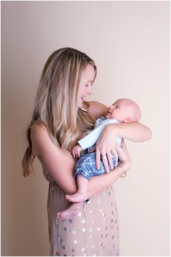 mom smiling down at infant son