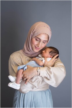 mom holding baby boy close