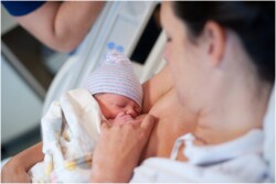 mom breastfeeding after giving birth