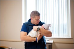 dad holding newborn son