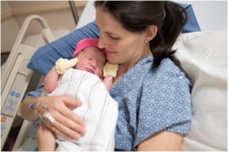 mom holding baby after birth