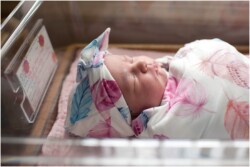 baby girl in hospital bassinet