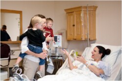 big brothers meeting baby