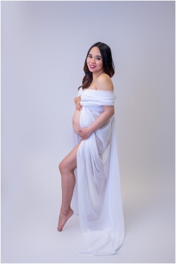 white chiffon fabric worn as maternity dress