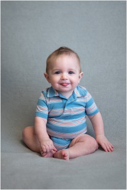 baby boy sticking out tongue