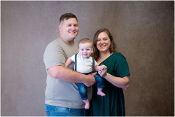 parents holding baby boy